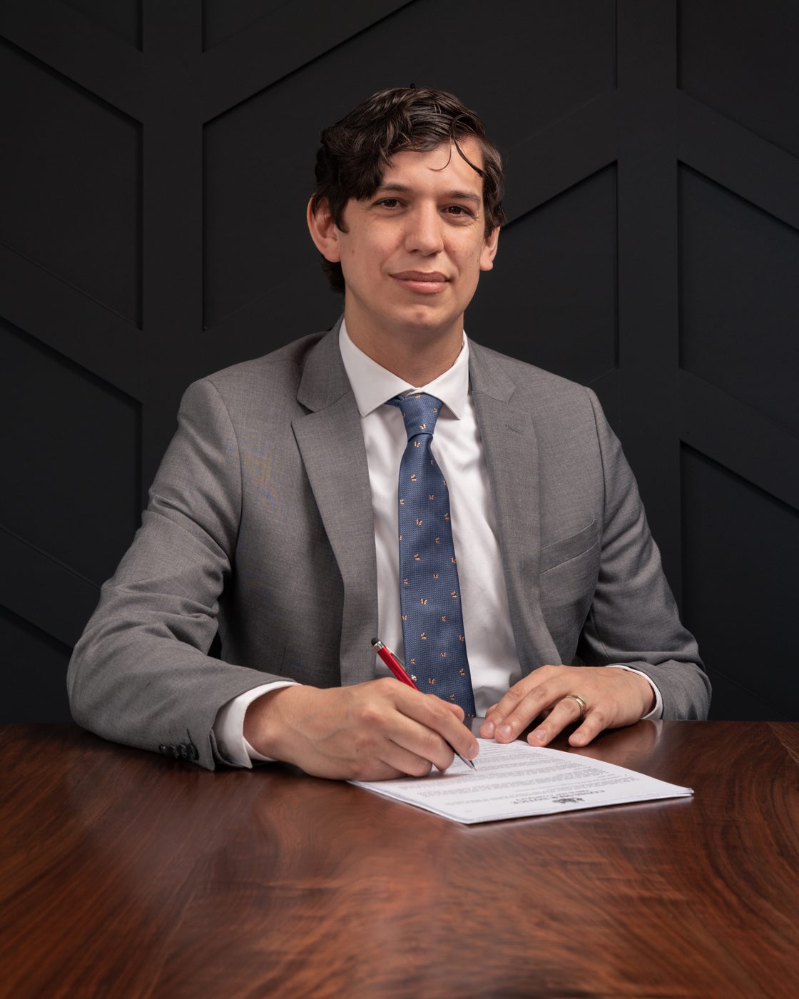 Estate Planning Attorney Jonathan Atkinson at a desk with legal papers