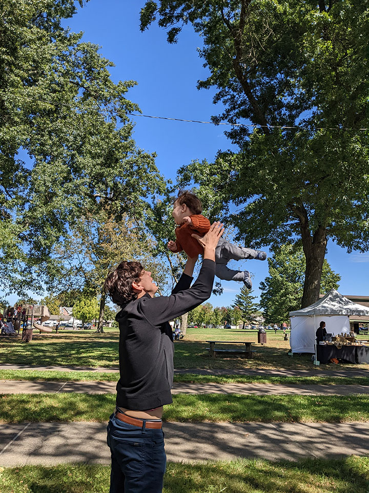 Estate Planning Attorney Jonathan Atkinson Tosses son david in the air